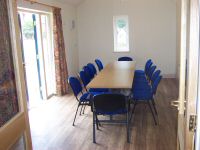 New meeting room with doors opening onto patio area.